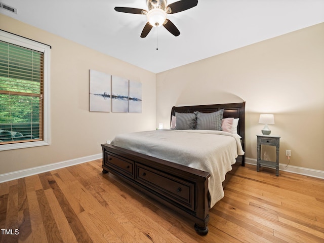 218 Inwood Forest Dr, Raleigh, NC 27603 - bedroom with light wood-style flooring and ceiling fan