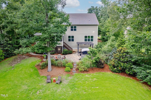 218 Inwood Forest Dr, Raleigh, NC 27603 - rear view of house with a yard, a patio area, a hot tub, stairs, and a shingled roof