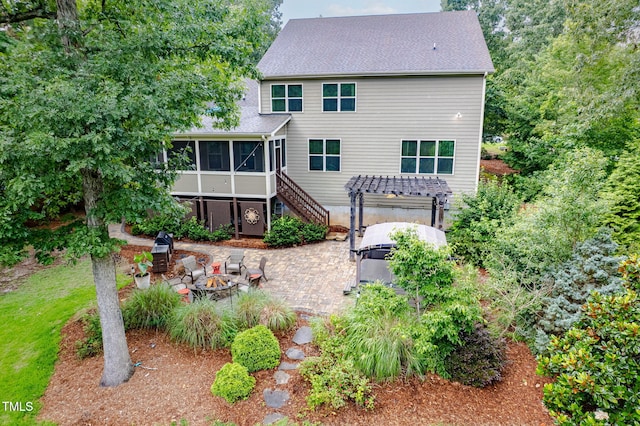 218 Inwood Forest Dr, Raleigh, NC 27603 - rear view of house with an outdoor fire pit, a sunroom, a patio, a pergola, and stairway