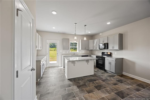 29 Red Bird Dr, Cameron, NC 28326 - kitchen with black appliances, a kitchen island, light stone counters, gray cabinets, and recessed lighting