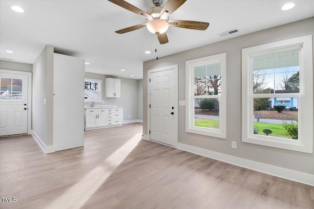 315 Byrd St, Clinton, NC 28328 - entrance foyer featuring healthy amount of natural light, light wood-style floors, ceiling fan, and recessed lighting