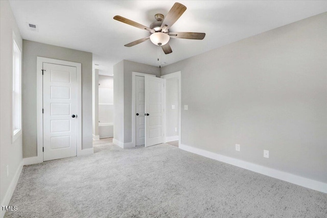 315 Byrd St, Clinton, NC 28328 - unfurnished bedroom featuring carpet flooring, ensuite bathroom, and ceiling fan