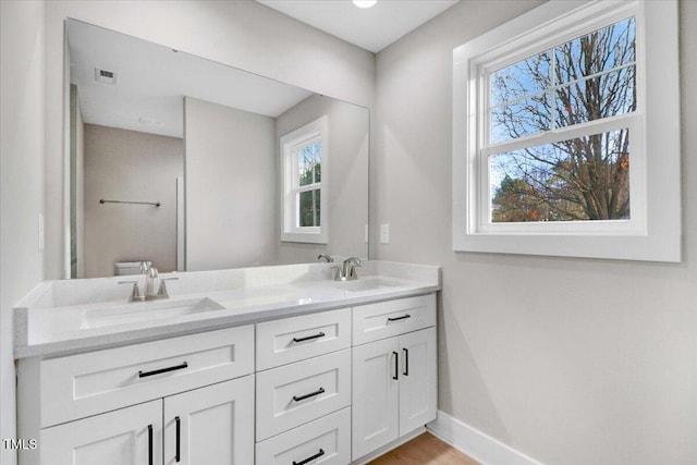315 Byrd St, Clinton, NC 28328 - bathroom with double vanity and baseboards