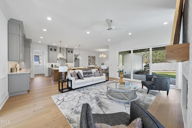 625 Glascock St, Raleigh, NC 27604 - living area featuring a ceiling fan, light wood-style floors, ornamental molding, and recessed lighting