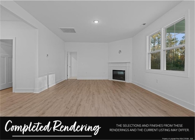 1006 E Prospect Ave, Raeford, NC 28376 - unfurnished living room with wood finished floors, a glass covered fireplace, and recessed lighting