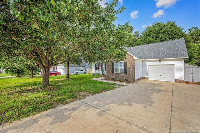 337 Buckeye Dr, Raeford, NC 28376 - view of property hidden behind natural elements featuring an attached garage, concrete driveway, a front lawn, a shingled roof, and crawl space