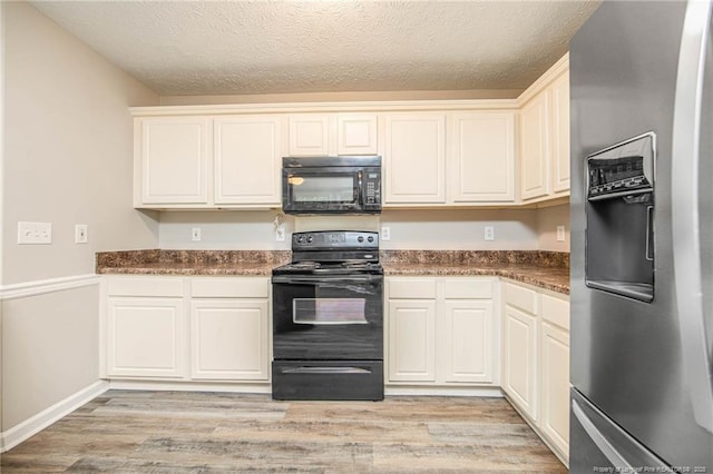 337 Buckeye Dr, Raeford, NC 28376 - kitchen with black appliances, light wood finished floors, and a textured ceiling