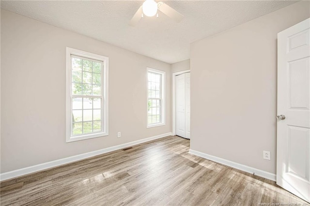 337 Buckeye Dr, Raeford, NC 28376 - unfurnished room featuring wood finished floors, ceiling fan, and a textured ceiling