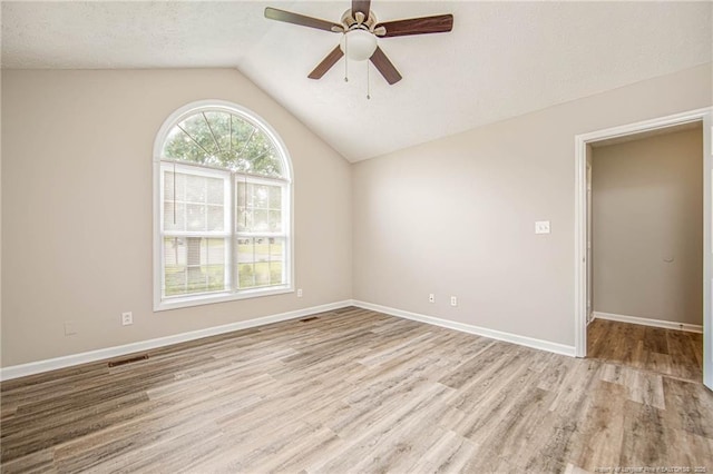337 Buckeye Dr, Raeford, NC 28376 - empty room featuring a ceiling fan, wood finished floors, lofted ceiling, and a textured ceiling