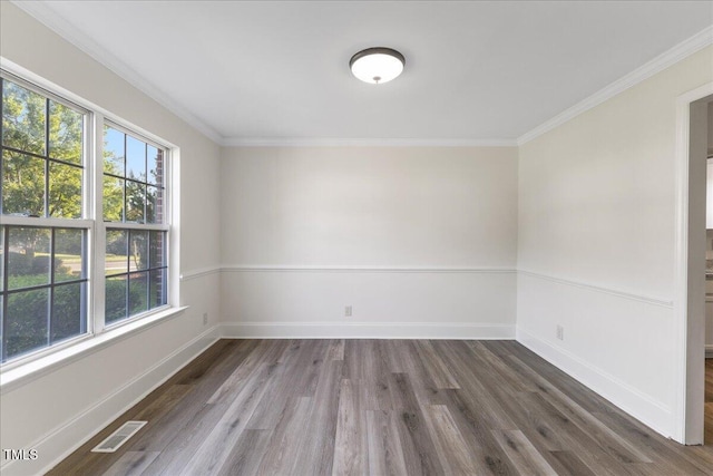 1209 Waterford Green Dr, Apex, NC 27502 - empty room featuring healthy amount of natural light, ornamental molding, and wood finished floors