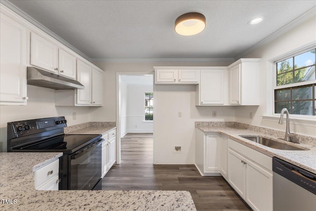 1209 Waterford Green Dr, Apex, NC 27502 - kitchen with black electric range, stainless steel dishwasher, under cabinet range hood, white cabinetry, and crown molding