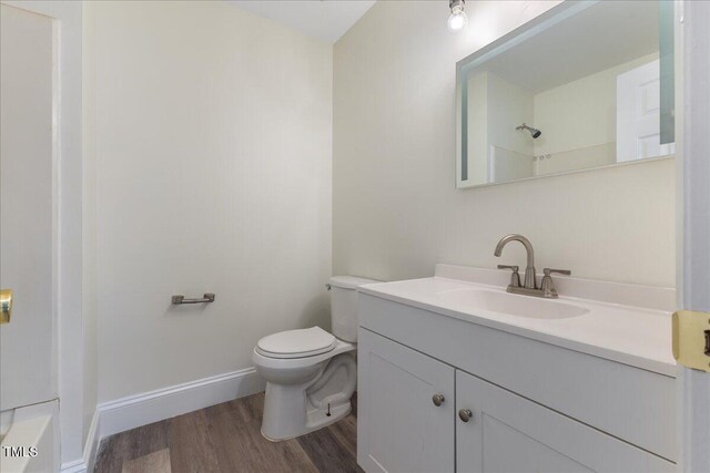 1209 Waterford Green Dr, Apex, NC 27502 - bathroom with wood finished floors, vanity, and a shower