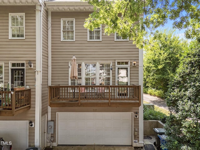 717 Mcclure Dr, Raleigh, NC 27603 - back of house with an attached garage and a balcony