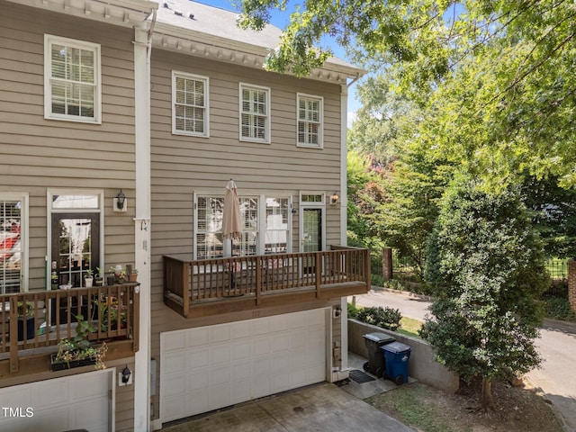 717 Mcclure Dr, Raleigh, NC 27603 - view of front of property featuring an attached garage, driveway, and a balcony