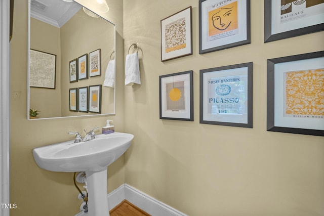 717 Mcclure Dr, Raleigh, NC 27603 - bathroom with crown molding and baseboards