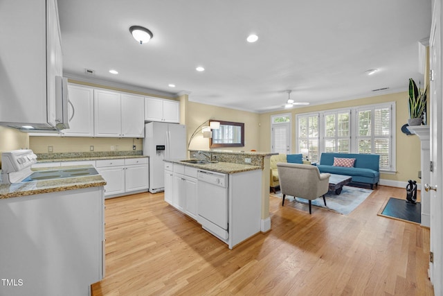 717 Mcclure Dr, Raleigh, NC 27603 - kitchen with white appliances, ornamental molding, white cabinetry, light wood-type flooring, and recessed lighting