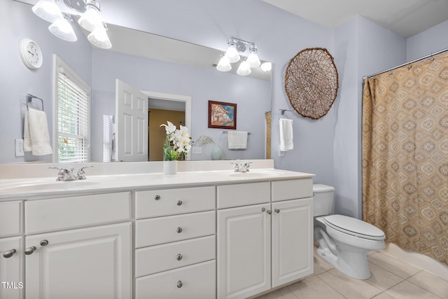 717 Mcclure Dr, Raleigh, NC 27603 - bathroom featuring double vanity, tile patterned flooring, curtained shower, and a chandelier