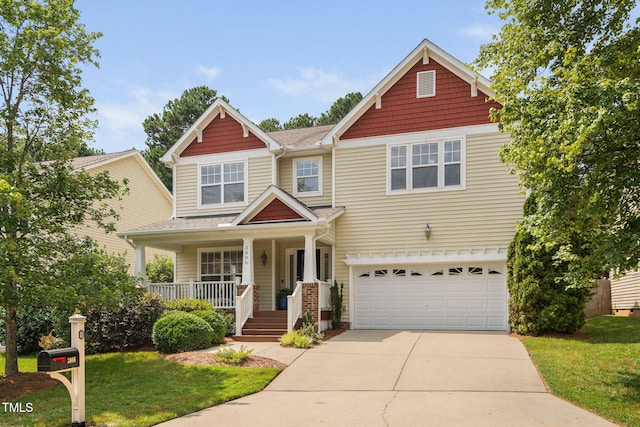 3806 Stoneybrook Dr, Durham, NC 27705 - craftsman-style home with a porch, a garage, concrete driveway, and a front yard