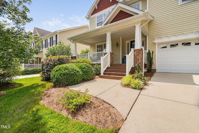 3806 Stoneybrook Dr, Durham, NC 27705 - view of front of home with a porch, a garage, and concrete driveway