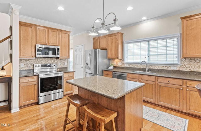 3806 Stoneybrook Dr, Durham, NC 27705 - kitchen with stainless steel appliances, crown molding, a kitchen island, decorative backsplash, and a kitchen breakfast bar