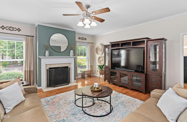 3806 Stoneybrook Dr, Durham, NC 27705 - living area with ceiling fan, wood finished floors, a fireplace, and crown molding