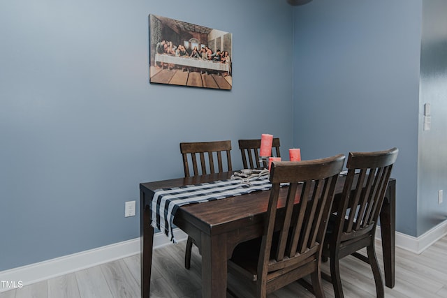 2586 Lacey Holt Rd, Graham, NC 27253 - dining room featuring baseboards and light wood-type flooring