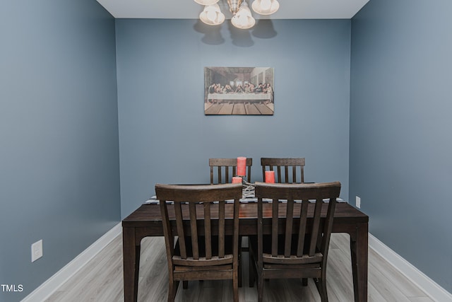 2586 Lacey Holt Rd, Graham, NC 27253 - dining space with a chandelier and wood finished floors