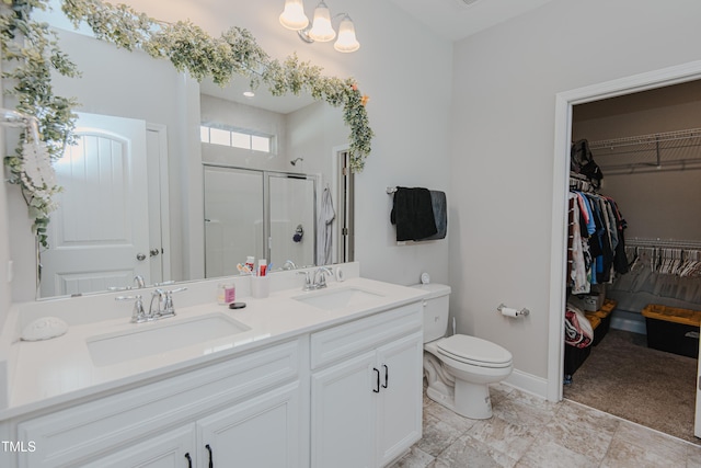 2586 Lacey Holt Rd, Graham, NC 27253 - full bath featuring a stall shower, a spacious closet, and double vanity