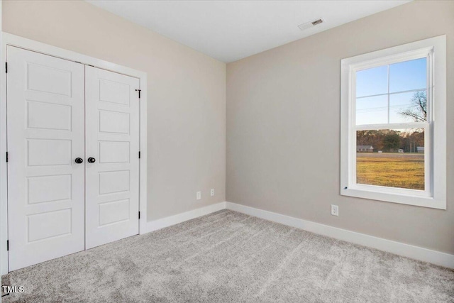 106 W Church St, Nashville, NC 27856 - unfurnished bedroom featuring carpet floors and a closet
