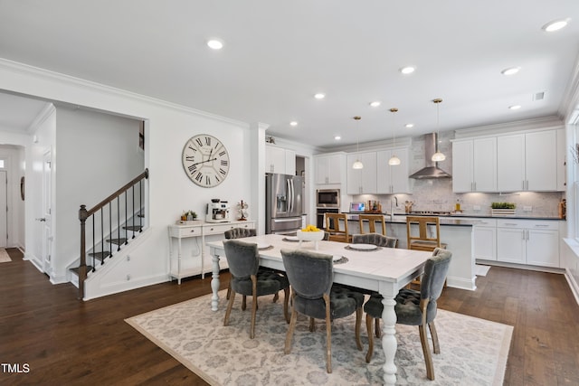 2013 Latham Oaks Ave, Wake Forest, NC 27587 - dining room featuring stairs, dark wood finished floors, crown molding, and recessed lighting