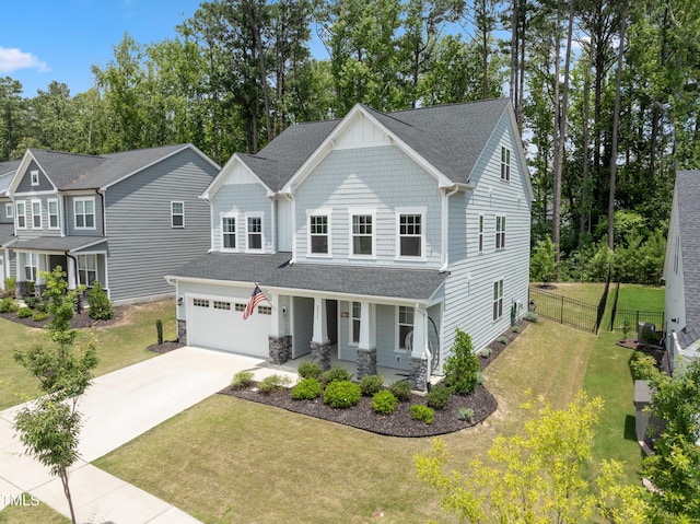 2013 Latham Oaks Ave, Wake Forest, NC 27587 - craftsman-style house with a porch, driveway, roof with shingles, an attached garage, and stone siding
