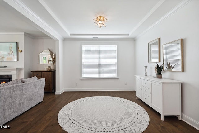 2013 Latham Oaks Ave, Wake Forest, NC 27587 - foyer entrance featuring a raised ceiling, dark wood finished floors, and a lit fireplace