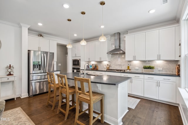 2013 Latham Oaks Ave, Wake Forest, NC 27587 - kitchen featuring wall chimney range hood, appliances with stainless steel finishes, dark countertops, dark wood-type flooring, and recessed lighting