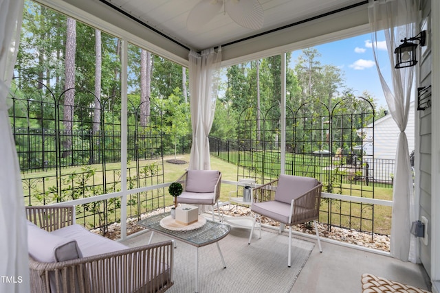 2013 Latham Oaks Ave, Wake Forest, NC 27587 - sunroom / solarium with ceiling fan, view of wooded area, and healthy amount of natural light