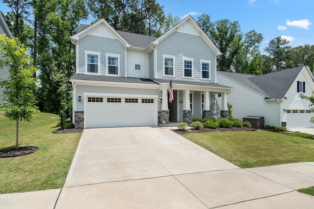 2013 Latham Oaks Ave, Wake Forest, NC 27587 - craftsman-style house featuring a porch, concrete driveway, an attached garage, stone siding, and a front yard