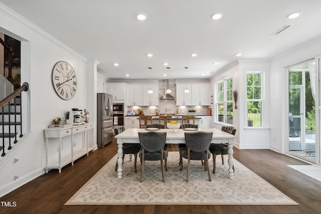 2013 Latham Oaks Ave, Wake Forest, NC 27587 - dining space with stairway, crown molding, dark wood-style floors, and recessed lighting