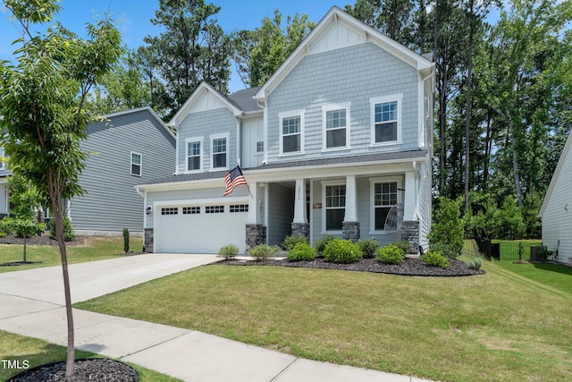2013 Latham Oaks Ave, Wake Forest, NC 27587 - craftsman house featuring concrete driveway, covered porch, stone siding, and an attached garage