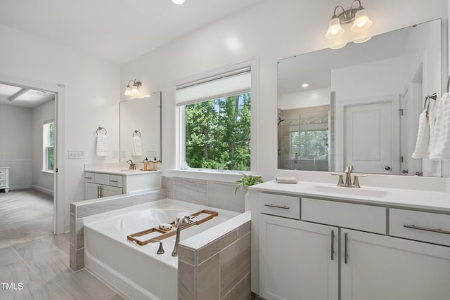 2013 Latham Oaks Ave, Wake Forest, NC 27587 - full bath with a garden tub, vanity, plenty of natural light, a shower stall, and recessed lighting