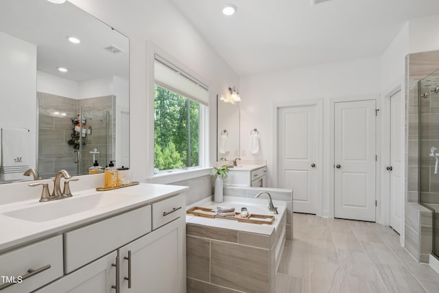 2013 Latham Oaks Ave, Wake Forest, NC 27587 - full bath with vanity, a shower stall, a garden tub, and recessed lighting
