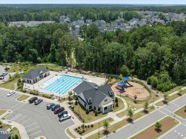 2013 Latham Oaks Ave, Wake Forest, NC 27587 - drone / aerial view of a pool and a heavily wooded area