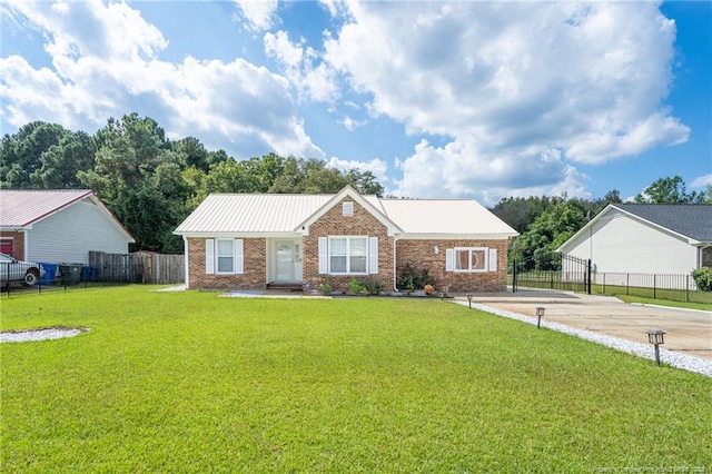 2140 Fargo Dr, Fayetteville, NC 28306 - view of front of house featuring brick siding and a metal roof