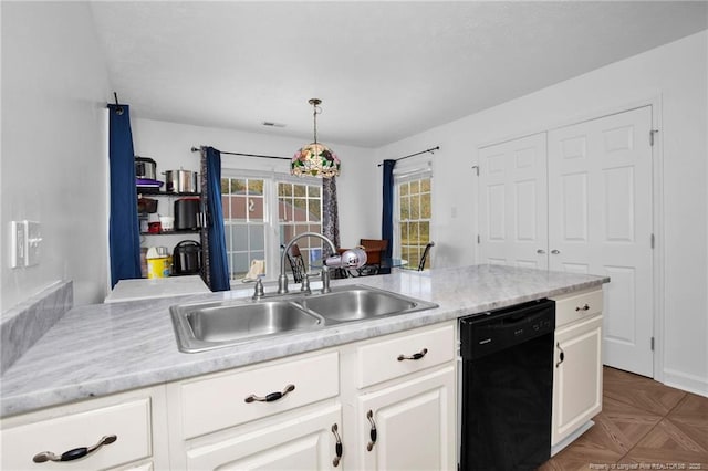2140 Fargo Dr, Fayetteville, NC 28306 - kitchen with black dishwasher, light countertops, and white cabinetry