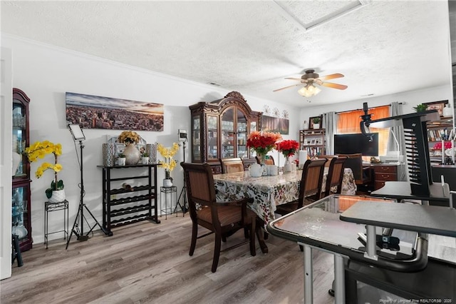 2140 Fargo Dr, Fayetteville, NC 28306 - dining space with a textured ceiling, wood finished floors, and ceiling fan