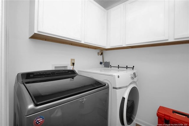 2140 Fargo Dr, Fayetteville, NC 28306 - washroom featuring washer and clothes dryer and cabinet space
