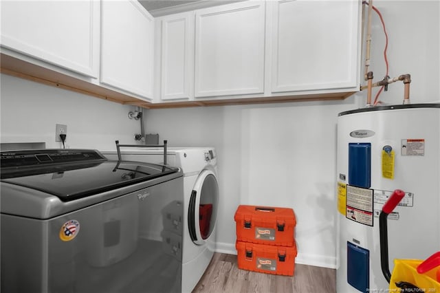 2140 Fargo Dr, Fayetteville, NC 28306 - laundry room with water heater, washer and clothes dryer, cabinet space, and wood finished floors