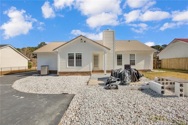 2140 Fargo Dr, Fayetteville, NC 28306 - back of property featuring a chimney and a metal roof