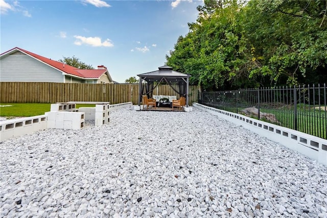 2140 Fargo Dr, Fayetteville, NC 28306 - fenced backyard with an outdoor hangout area and a gazebo