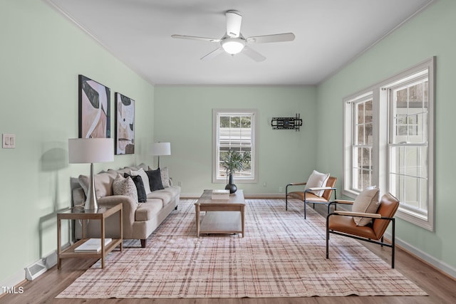 1408 Old Ivey Rd, Apex, NC 27523 - living area with wood finished floors, ceiling fan, and crown molding