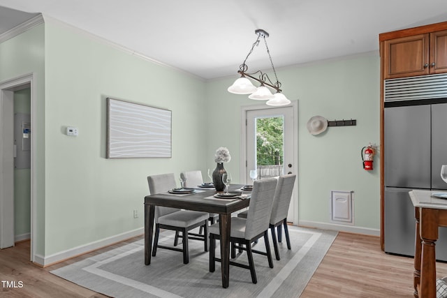 1408 Old Ivey Rd, Apex, NC 27523 - dining room with ornamental molding and light wood-style floors