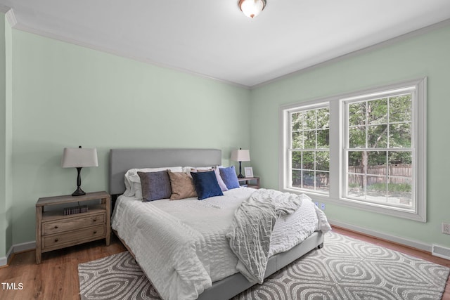 1408 Old Ivey Rd, Apex, NC 27523 - bedroom with wood finished floors and ornamental molding